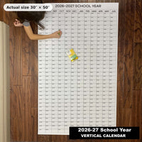 Thumbnail for Child writing on the 2026-27 School Year giant wall calendar on the floor, showing its real 30 x 50 inch size