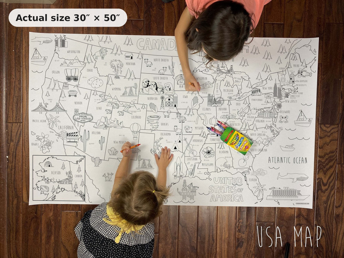 Two kids coloring the giant USA coloring map on the floor, showing its real 30 x 50 inch size