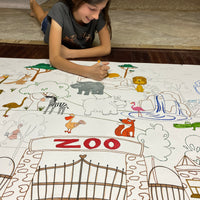 Thumbnail for The Zoo giant coloring sheet being colored in with markers at a table