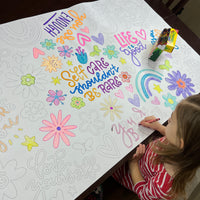 Thumbnail for The Love Yourself giant coloring sheet being colored in with markers at a table