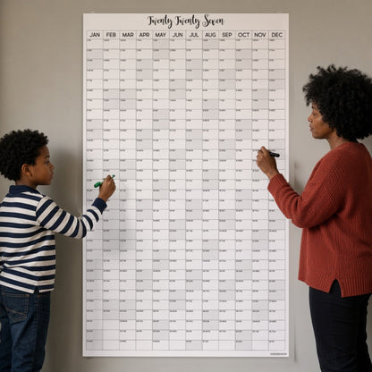 2027 vertical wall calendar on a kitchen wall with mom and son