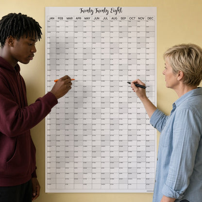 2028 vertical yearly wall calendar on a kitchen wall with teen and grandmother