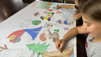 Thumbnail for The summer giant coloring sheet being colored in with markers at a table