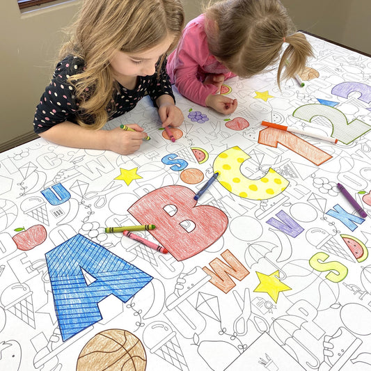 Kids coloring the ABC 123 Table Size Coloring Sheet at home
