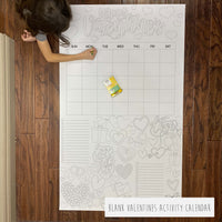 Thumbnail for Child coloring the Valentines Activity Calendar giant coloring sheet on a wood floor