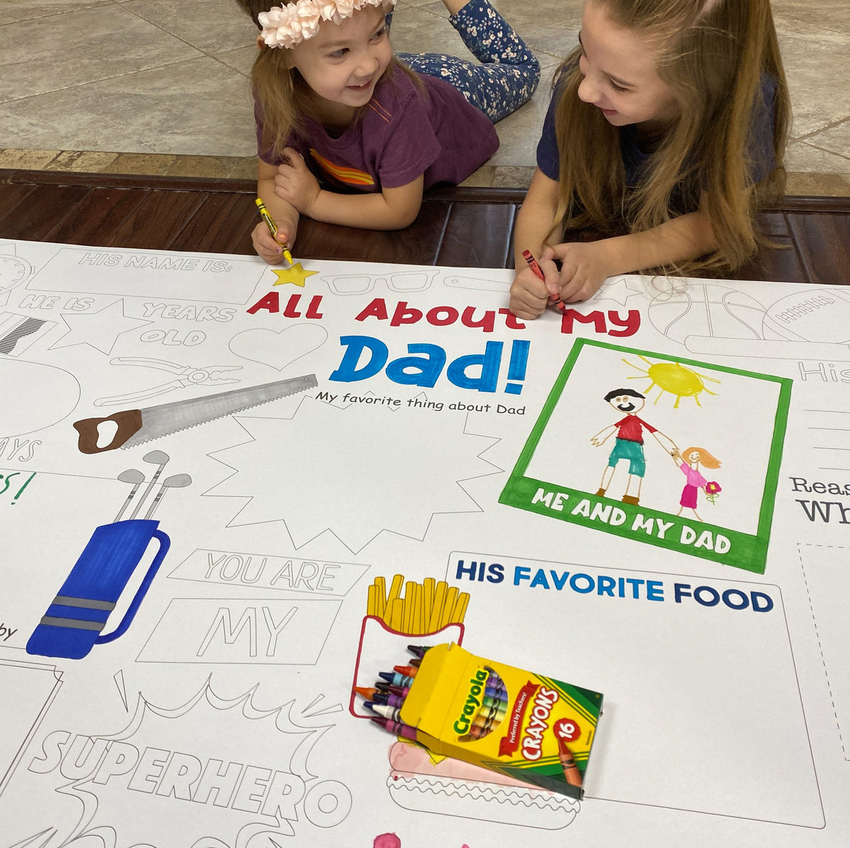 The All About Dad giant coloring sheet being colored in with markers at a table