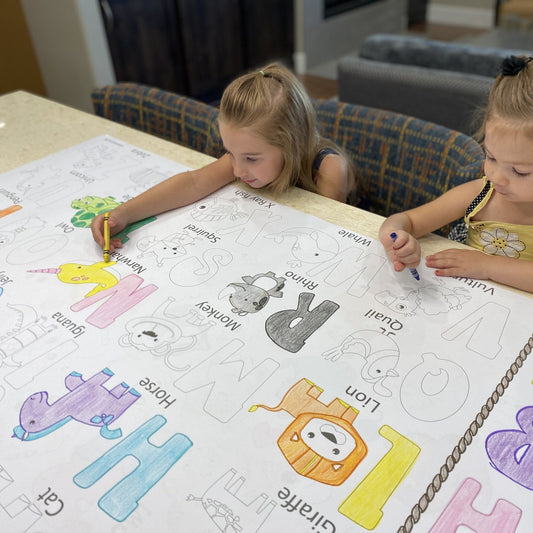 Kids coloring the Alphabet Table Size Coloring Sheet at home