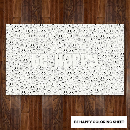 Be Happy giant 30x50 coloring sheet laid flat on a wood floor