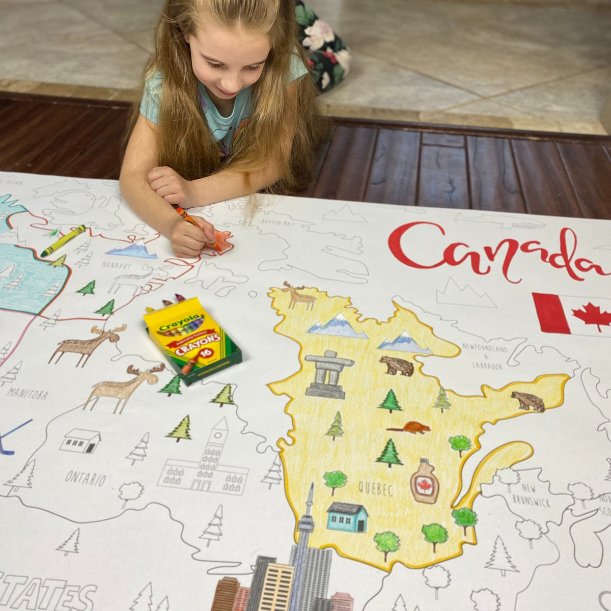Kids coloring the Canada Coloring Map at home