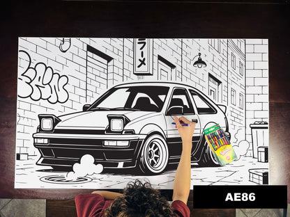 Giant coloring sheet of an 80s hatchback coupe, with a box of crayons