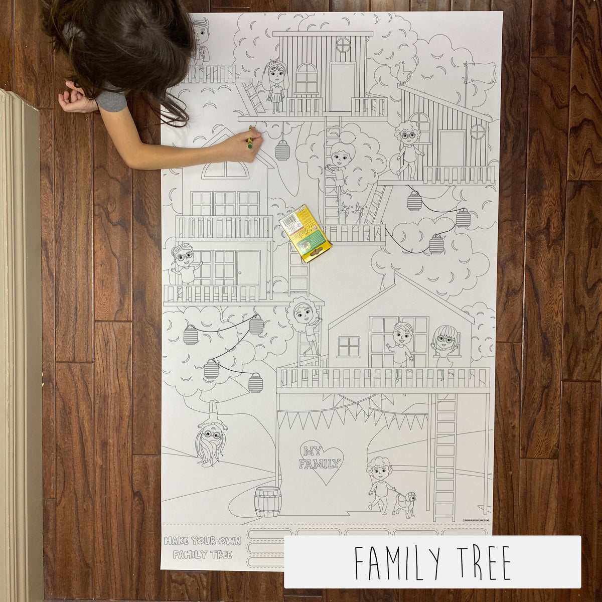 Child coloring the Family Tree giant coloring sheet on a wood floor with crayons