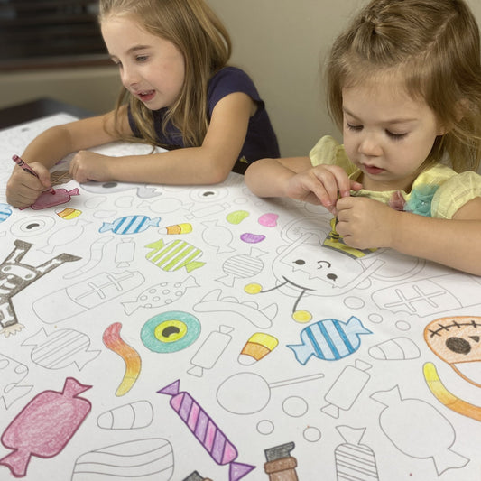 Kids coloring the Halloween Costume Table Size Coloring Sheet at home