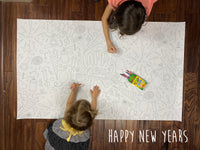 Thumbnail for Child coloring the Happy New Year giant coloring sheet on a wood floor with crayons
