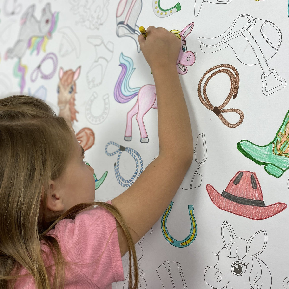 Kids coloring the Horses Table Size Coloring Sheet at home