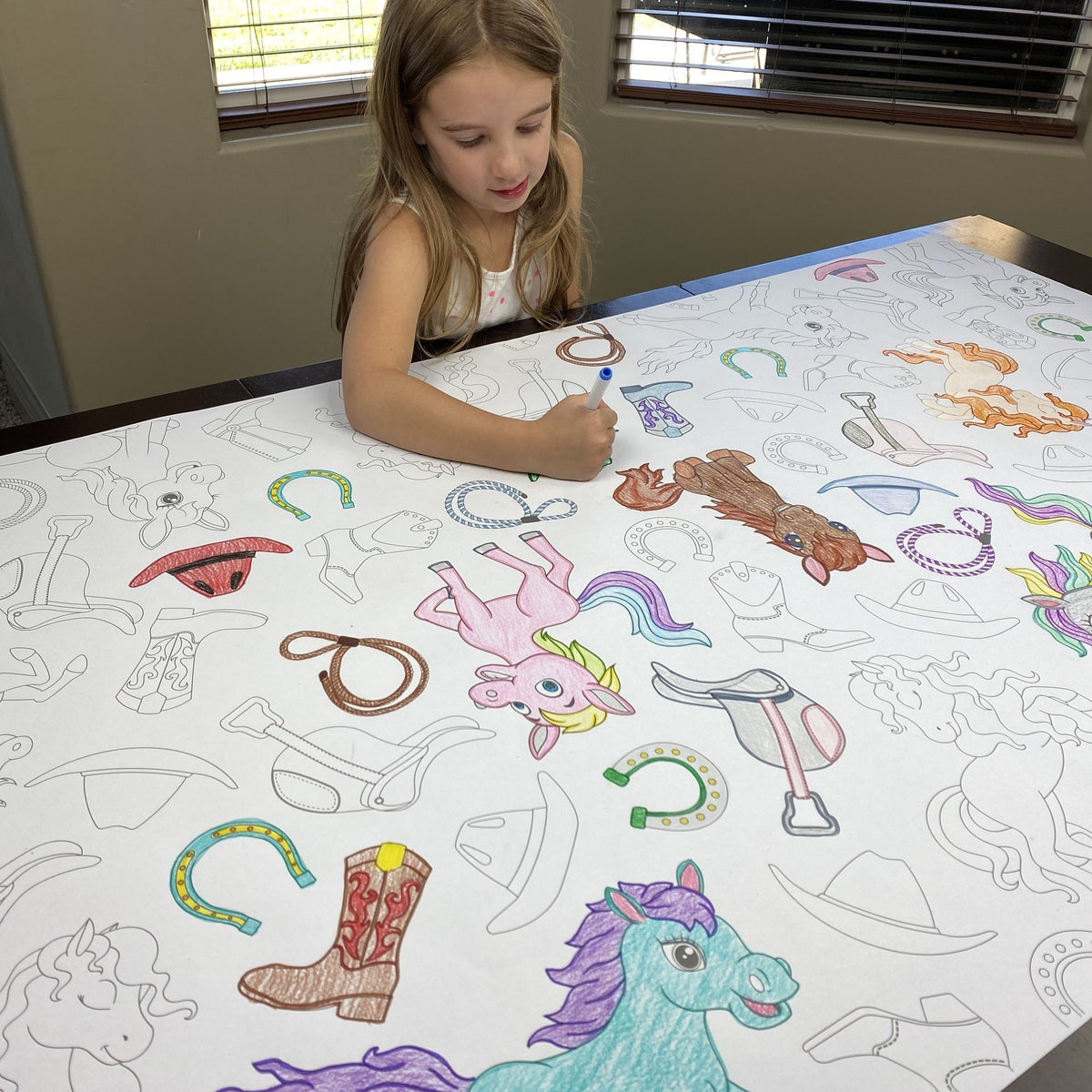 The Horses Table Size Coloring Sheet being colored by kids at home