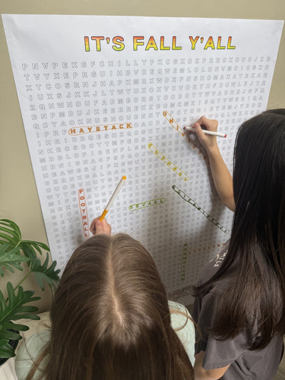 Two girls solving the It's Fall Y'all Giant Word Search Puzzle with markers, giant 30x44.5 inch sheet