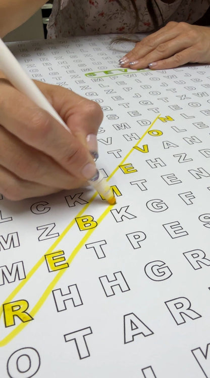 Close-up of the It's Fall Y'all giant word search with found words circled in color