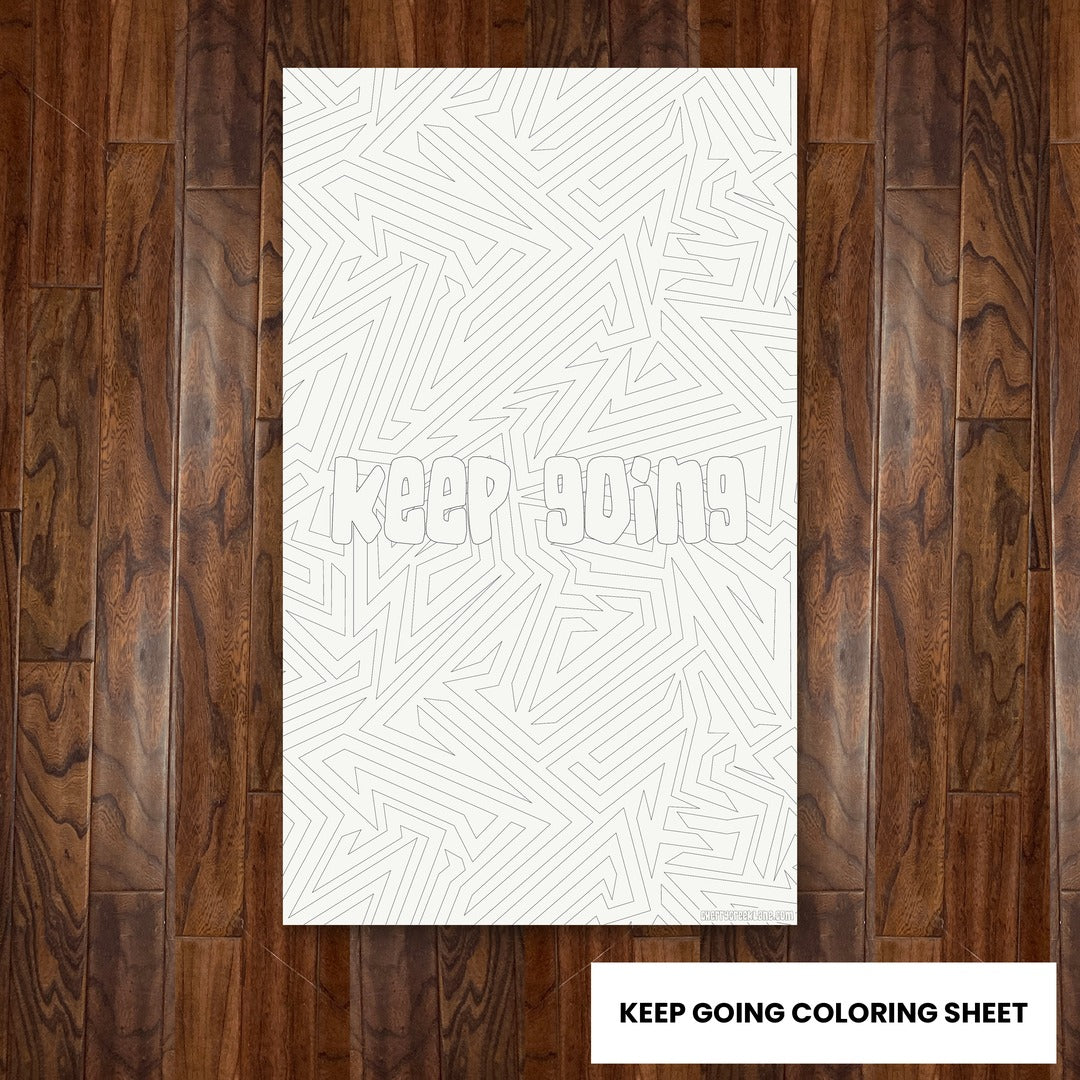 Keep Going giant 30x50 coloring sheet laid flat on a wood floor