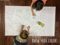 Thumbnail for Child coloring the Know Your Colors giant coloring sheet on a wood floor with crayons