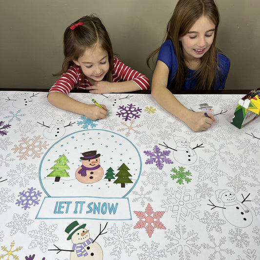 Kids coloring the Let it Snow Table Size Coloring Sheet at home