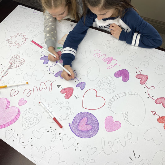 Kids coloring the Love Table Size Coloring Sheet at home