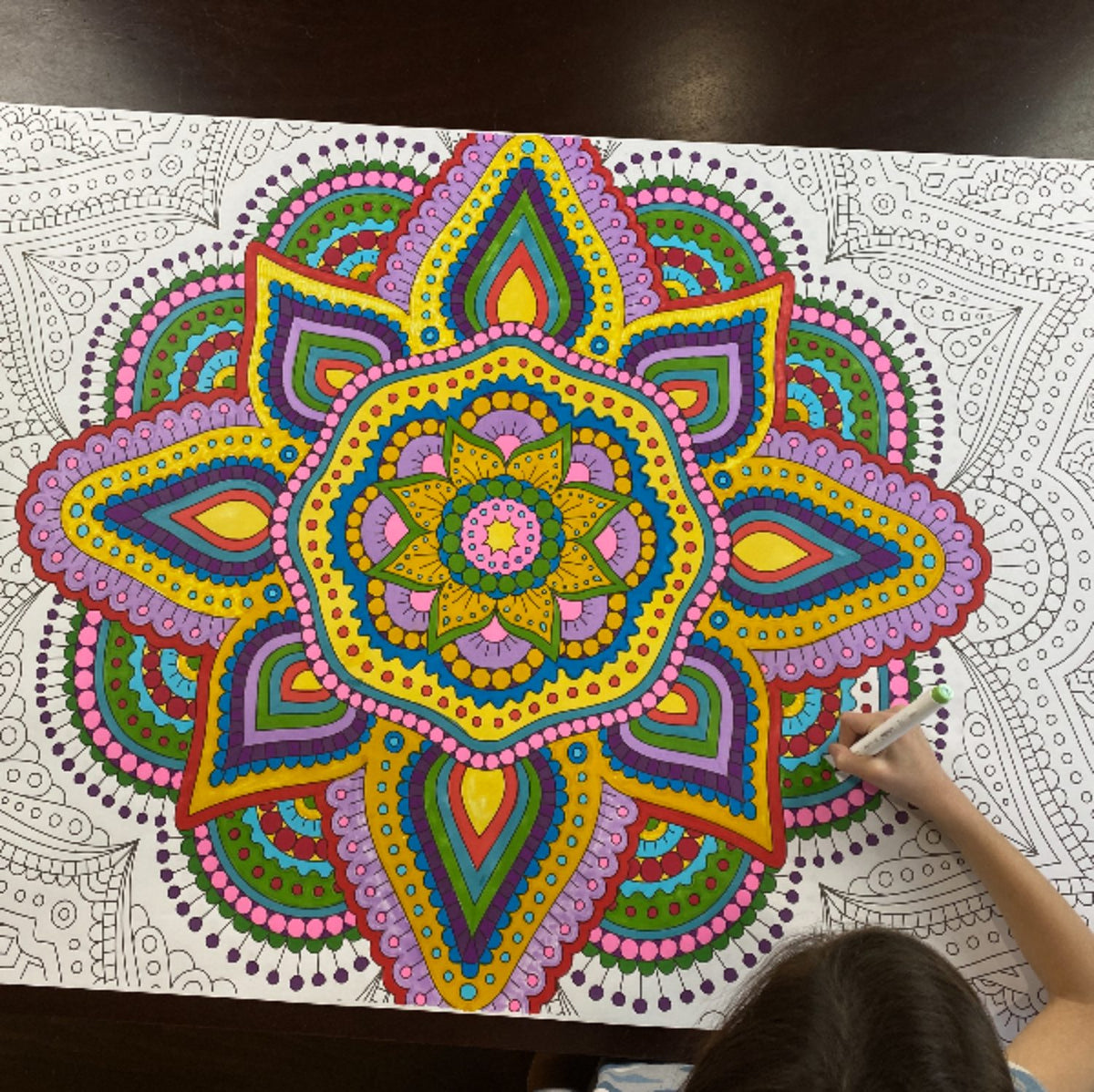 Close-up of the Zentangle Mandala coloring sheet colored in with markers