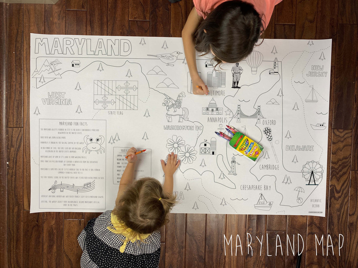 Child coloring the Maryland state giant coloring map on a wood floor