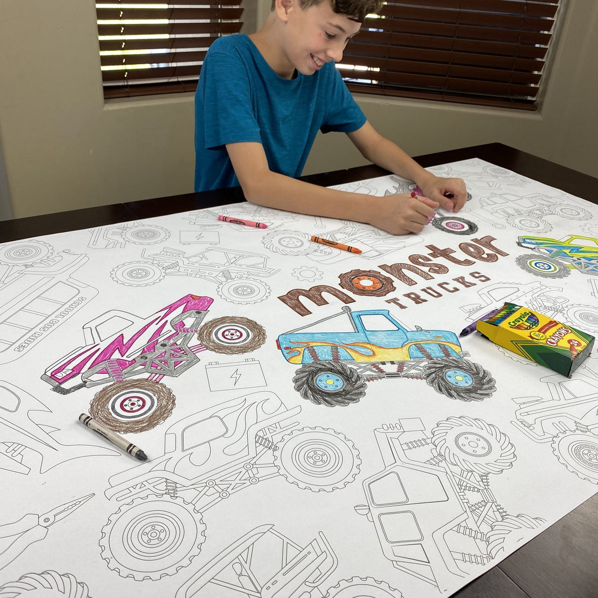 Kids coloring the Monster Trucks Table Size Coloring Sheet at home