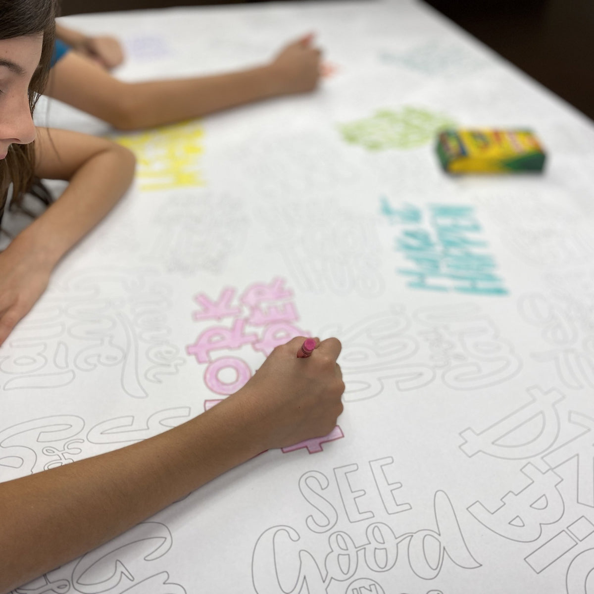 Kids coloring the Motivation Quotes Table Size Coloring Sheet at home
