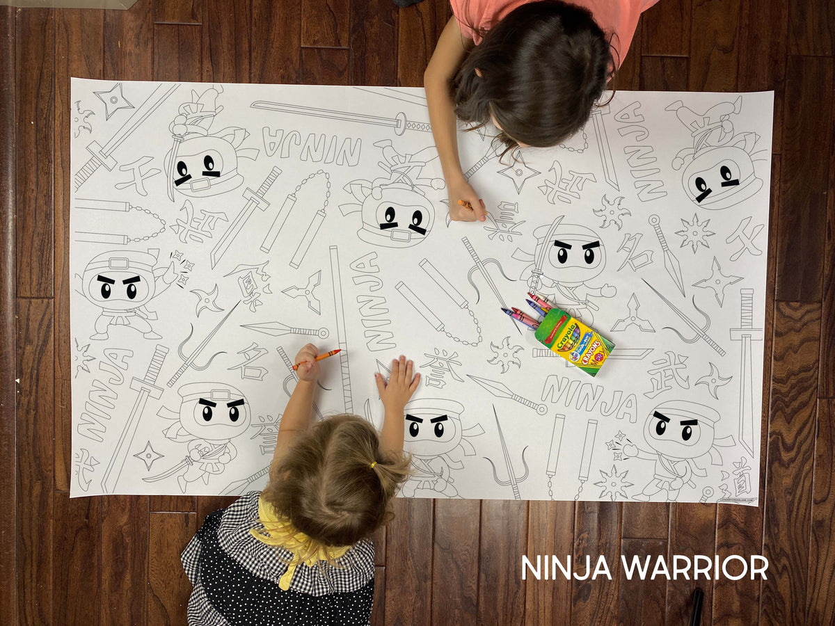 Child coloring the Ninja Warrior giant coloring sheet on a wood floor with crayons