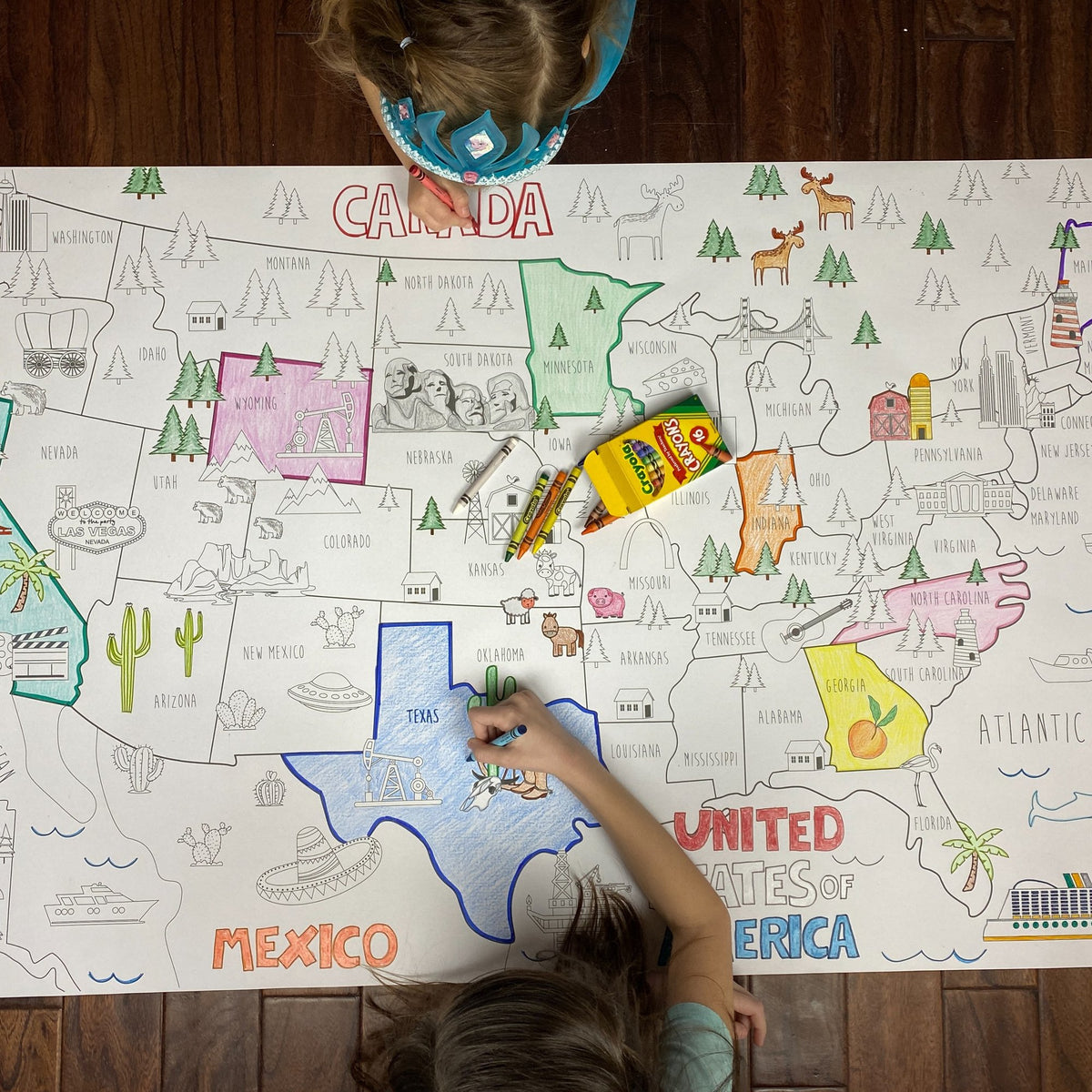 Kids coloring the North America Coloring Map at home