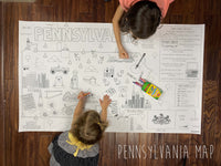 Thumbnail for Child coloring the Pennsylvania state giant coloring map on a wood floor