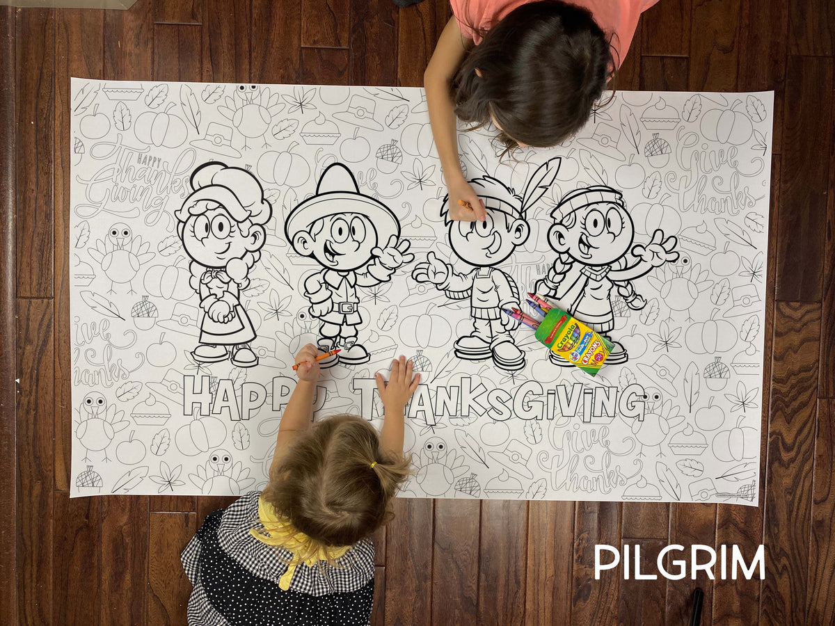 Child coloring the Pilgrim giant coloring sheet on a wood floor with crayons
