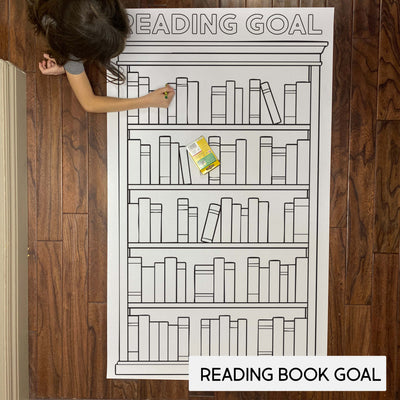 Child coloring the Reading Goals giant coloring sheet on a wood floor with crayons