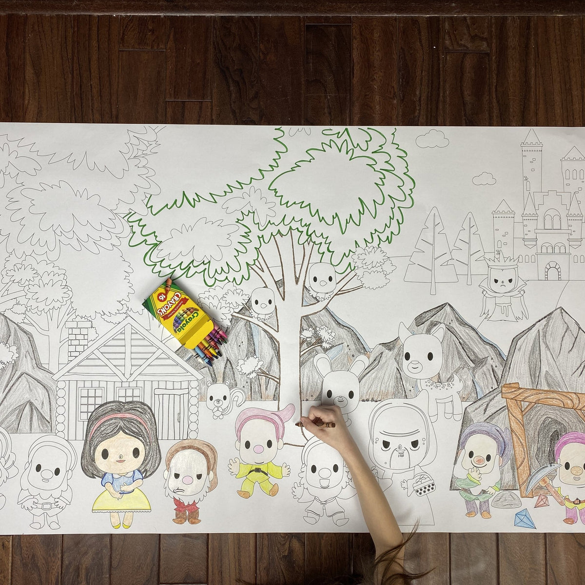 The Snow White Table Size Coloring Sheet being colored by kids at home