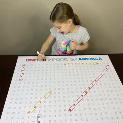 Kids circling words on the United States Giant Word Search Puzzle at home