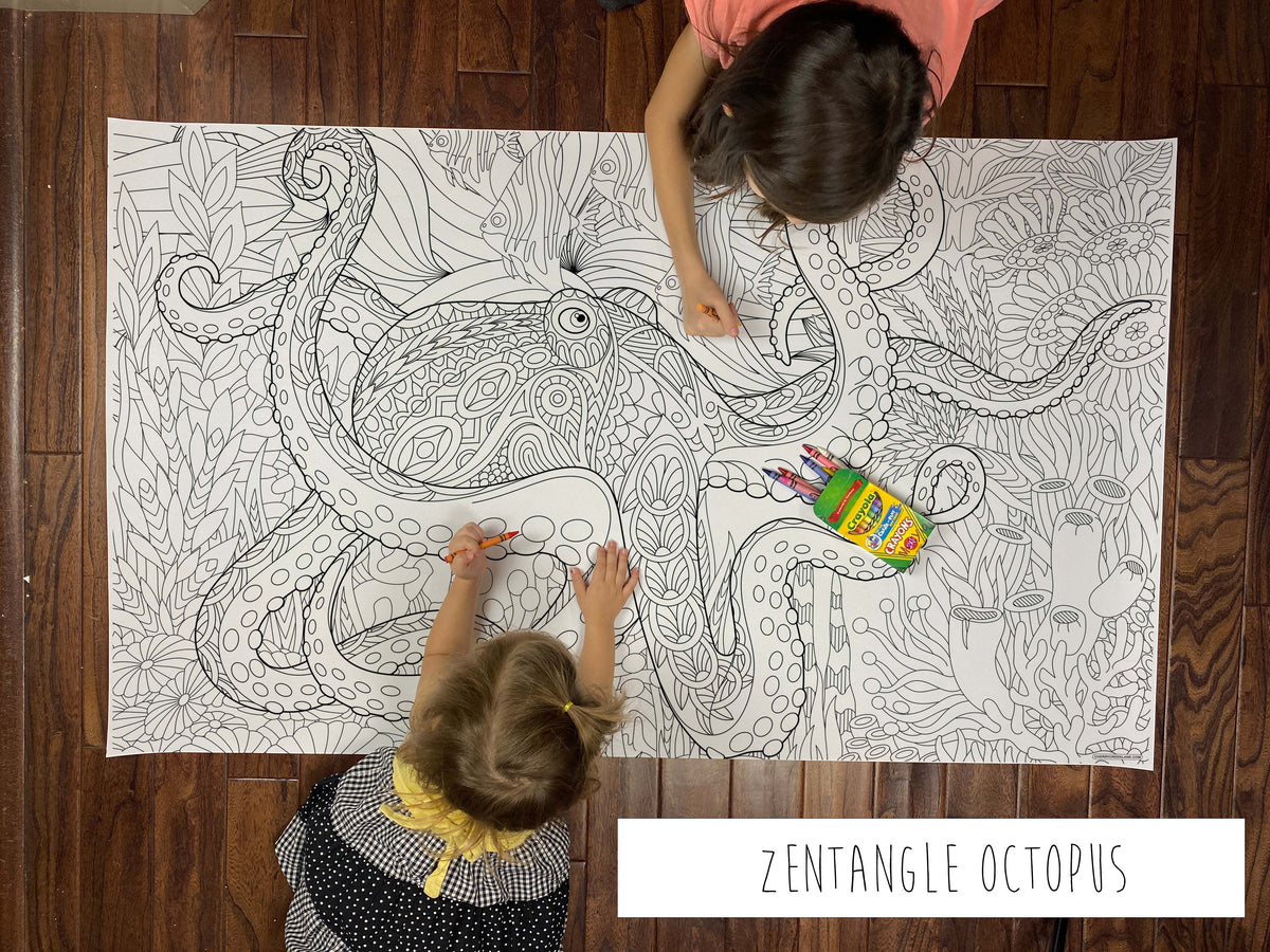 Child coloring the Zentangle Octopus giant coloring sheet on a wood floor with crayons