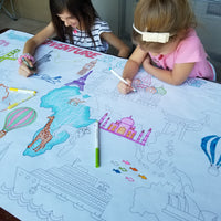 Thumbnail for The Adventure Awaits giant coloring sheet being colored in with markers at a table