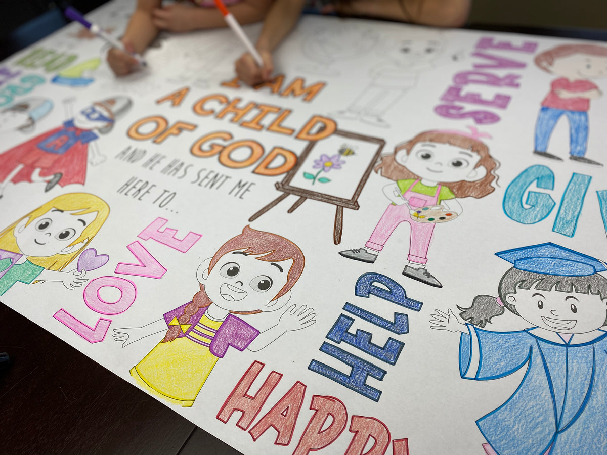 The Child of God giant coloring sheet being colored in with markers at a table