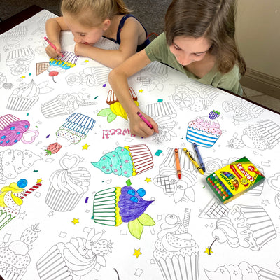 The Cupcakes giant coloring sheet being colored in with markers at a table