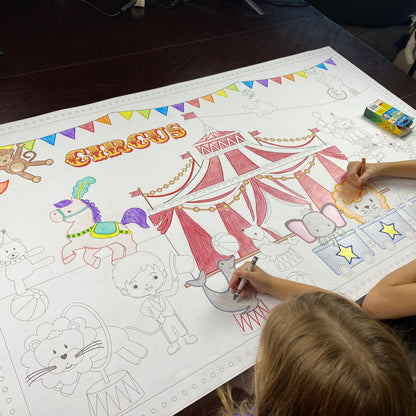 The Circus giant coloring sheet being colored in with markers at a table
