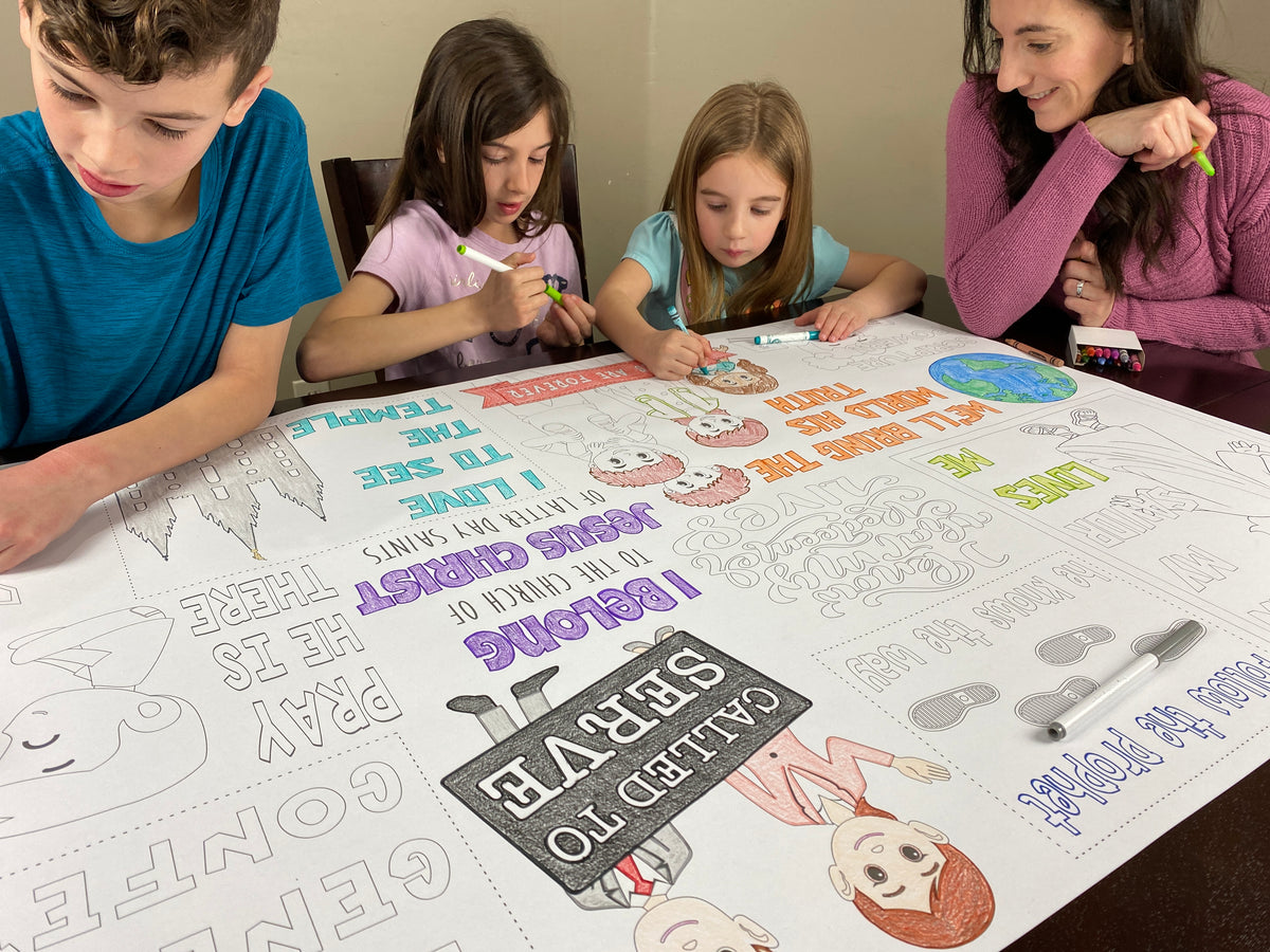 The I love General Conference giant coloring sheet being colored in with markers at a table