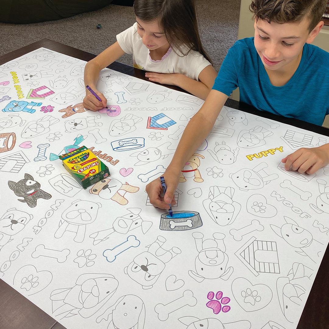 The Puppy giant coloring sheet being colored in with markers at a table