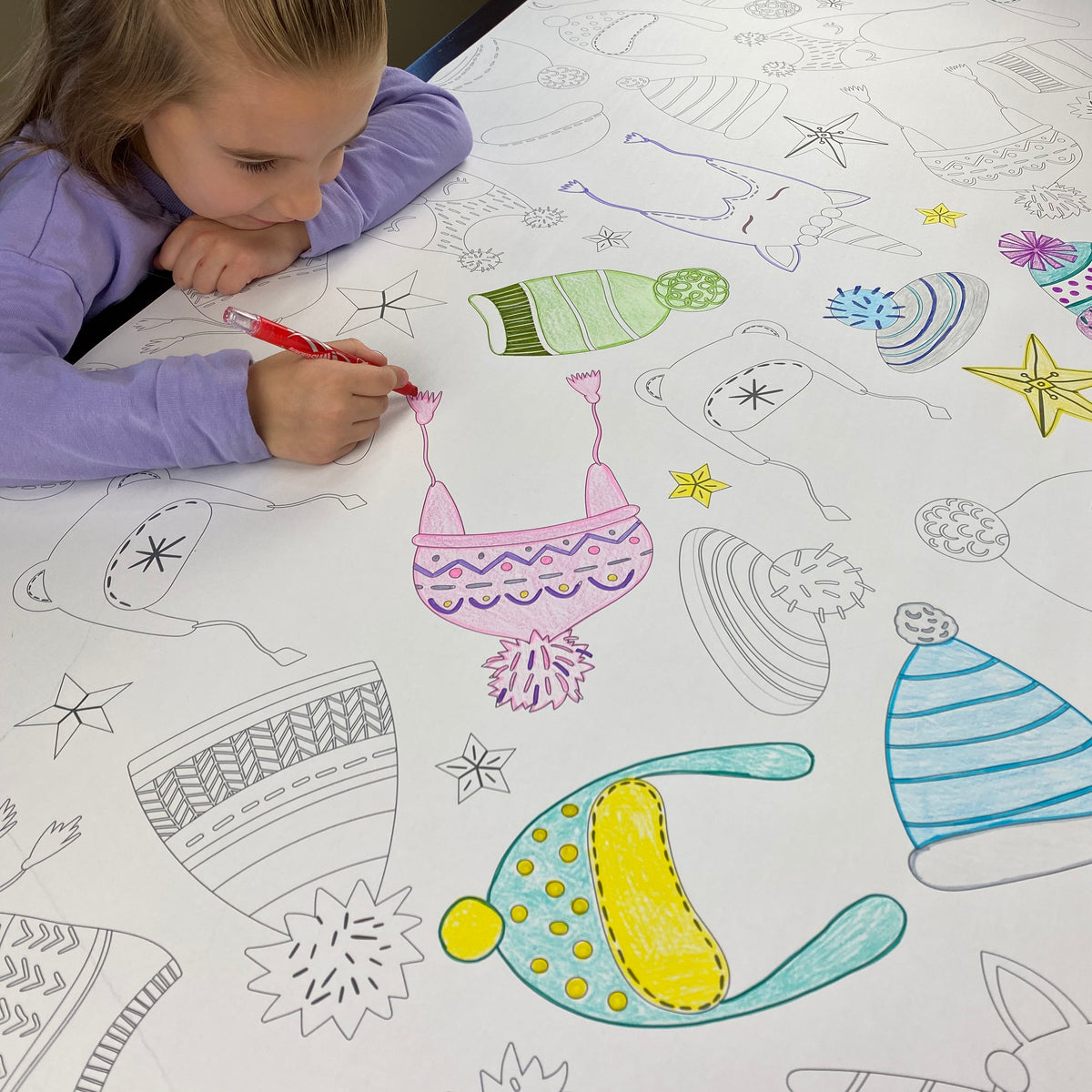 Close-up of the Winter Hats coloring sheet colored in with markers