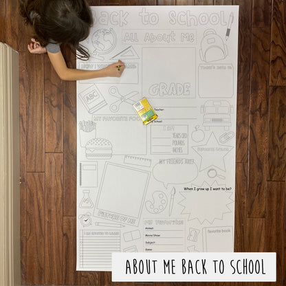 Child coloring the About Me Back to School giant coloring sheet on a wood floor with crayons