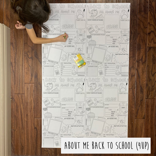 Child coloring the About Me Back to School 4-up giant coloring sheet on a wood floor with crayons
