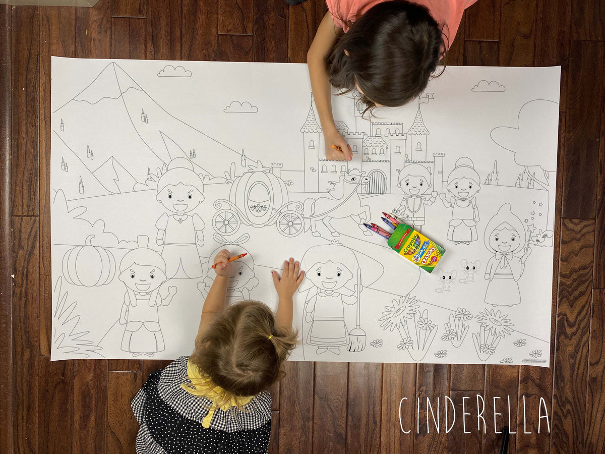 Child coloring the Cinderella giant coloring sheet on a wood floor with crayons