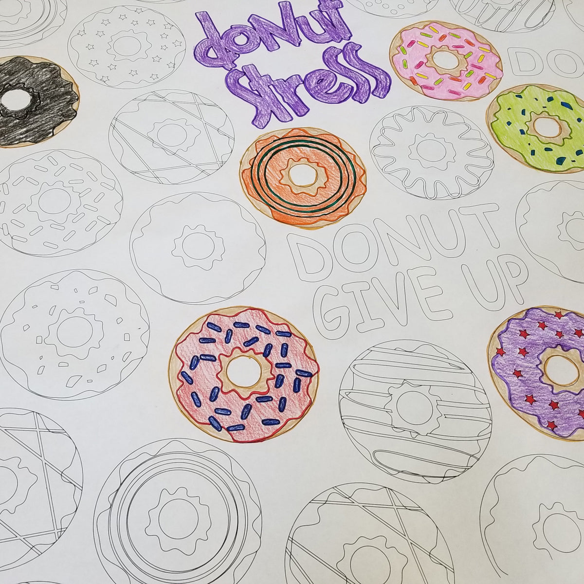 Close-up of the Donut coloring sheet colored in with markers