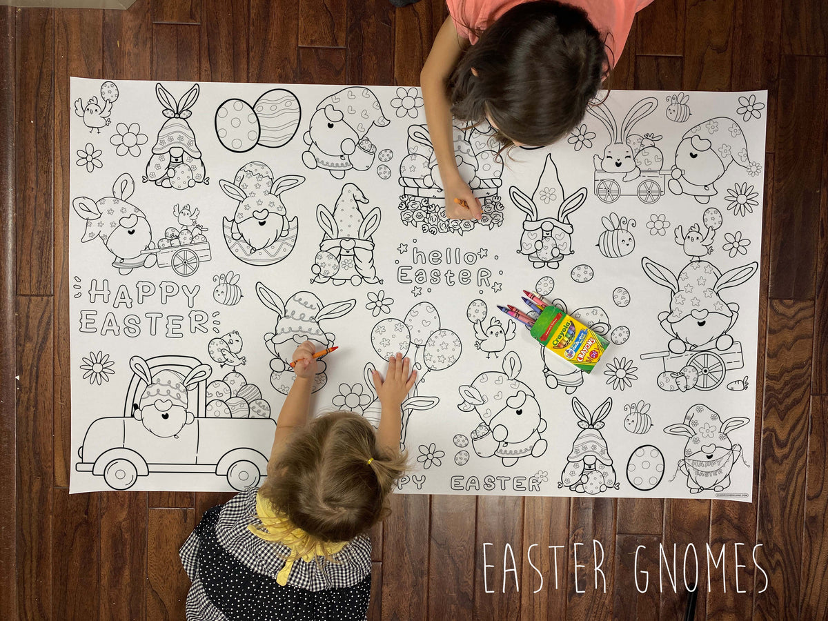 Child coloring the Easter Gnomes giant coloring sheet on a wood floor with crayons