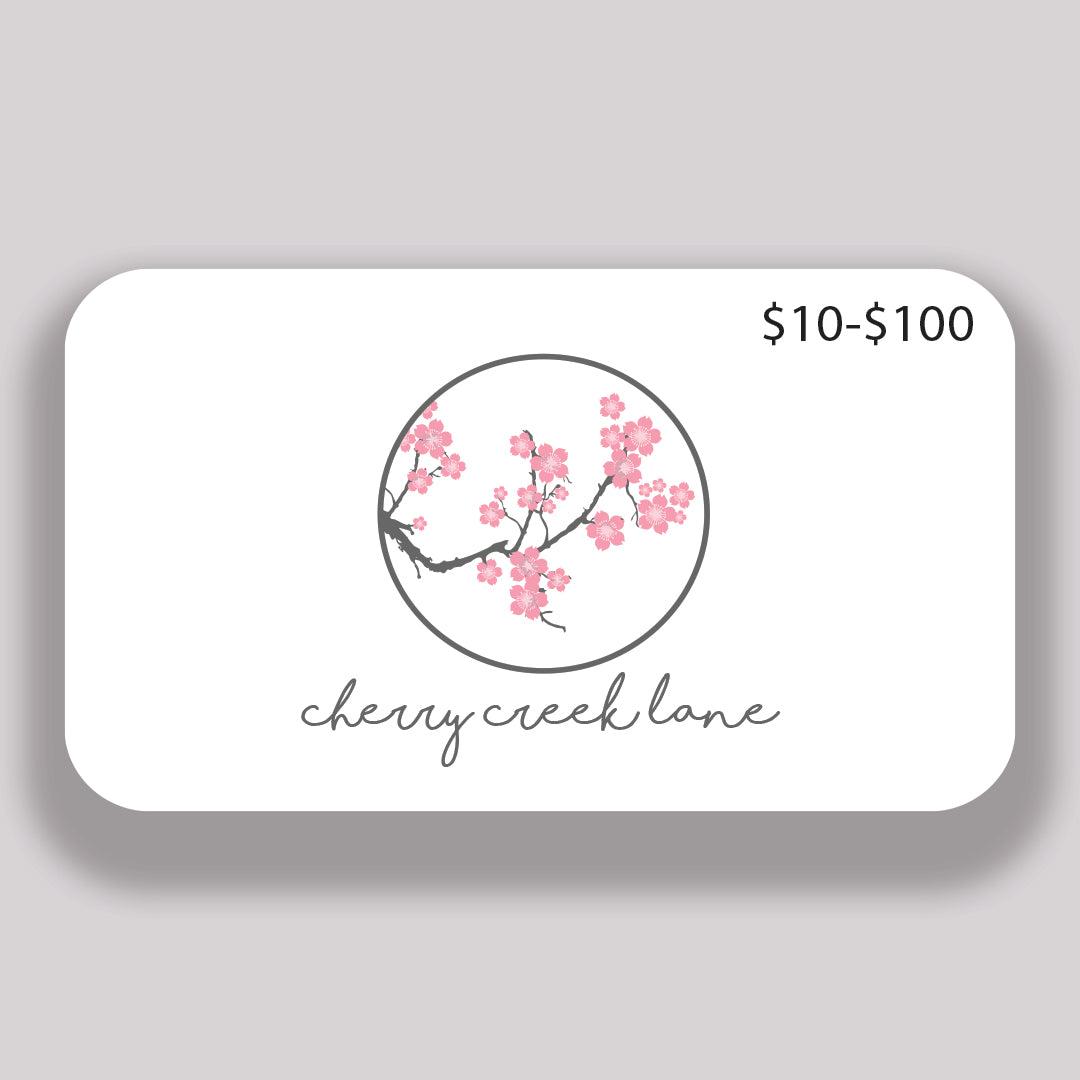 Cherry Creek Lane gift card with the cherry blossom logo
